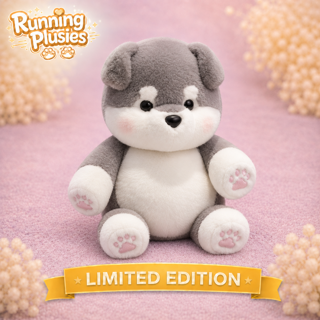 A plush dog toy with gray and white fur sits centered on a pink textured surface with decorative beige flower-like props in the corners. The logo 'Running Plushies' appears in the top left, and a yellow banner at the bottom reads 'LIMITED EDITION'.