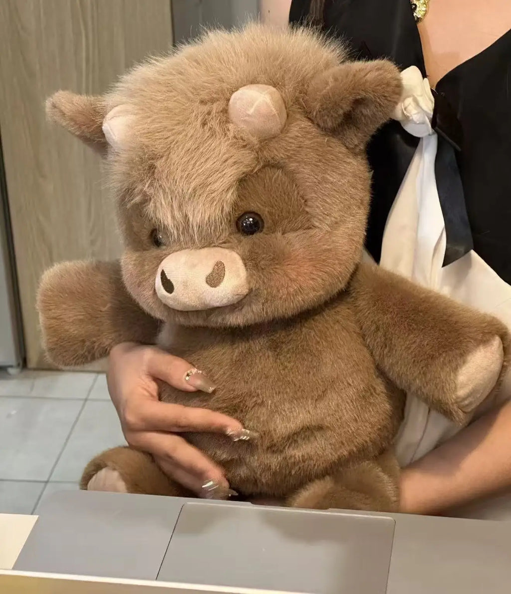 Person holding a brown teddy bear with a blurred background